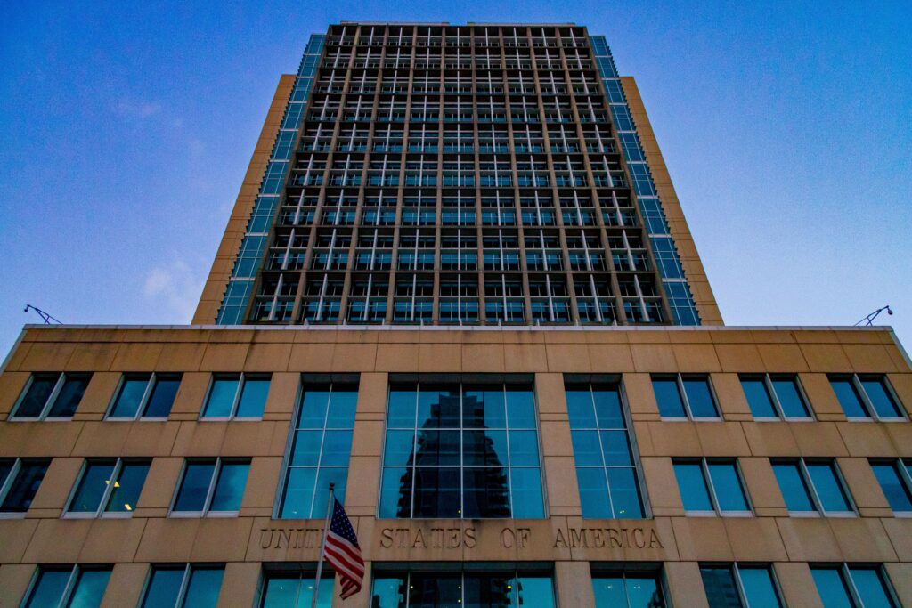 A low-angle view of a skyscraper in Tampa, FL, USA, captured at dusk, showcasing its architectural design.